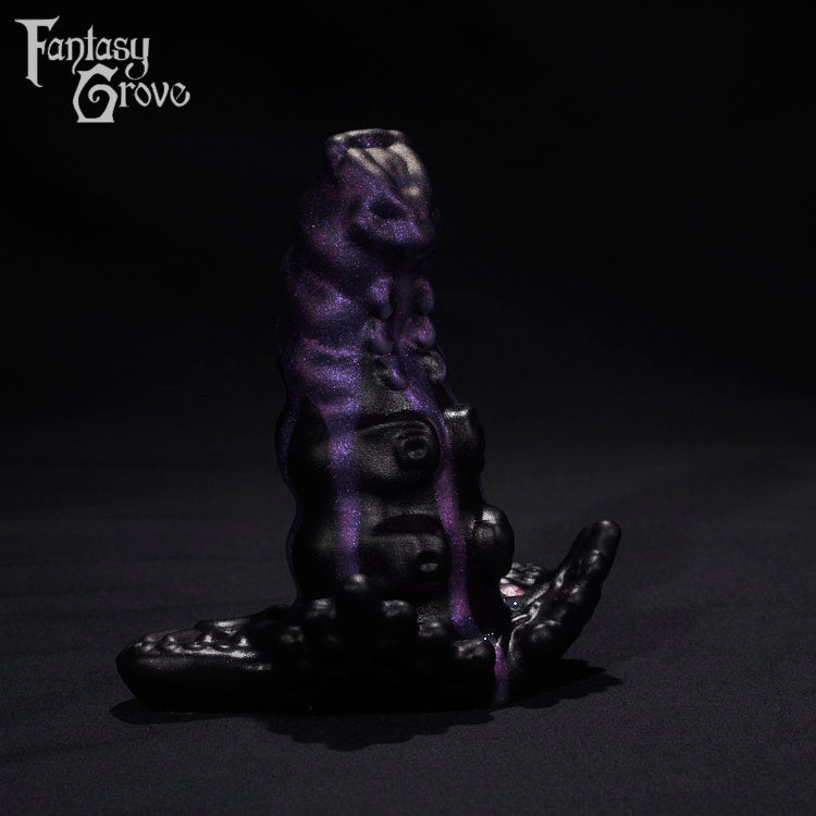A Fantasy Grove sex toy on a black background with a logo in the upper left corner