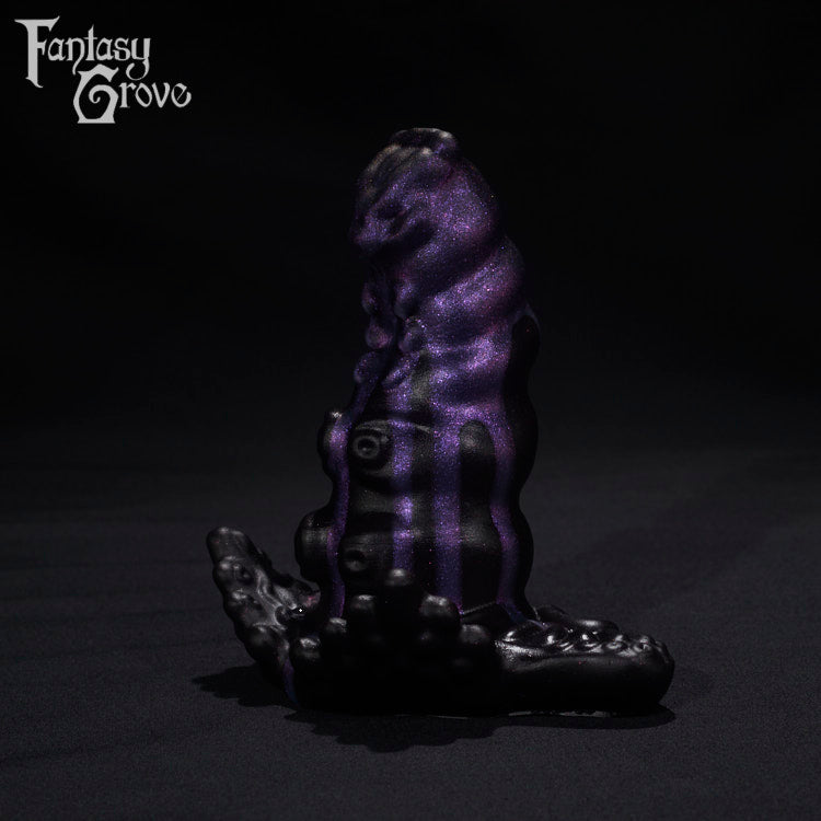 A Fantasy Grove sex toy on a black background with a logo in the upper left corner