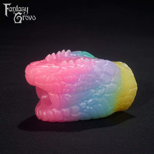 A Fantasy Grove sex toy on a black background with a logo in the upper left corner