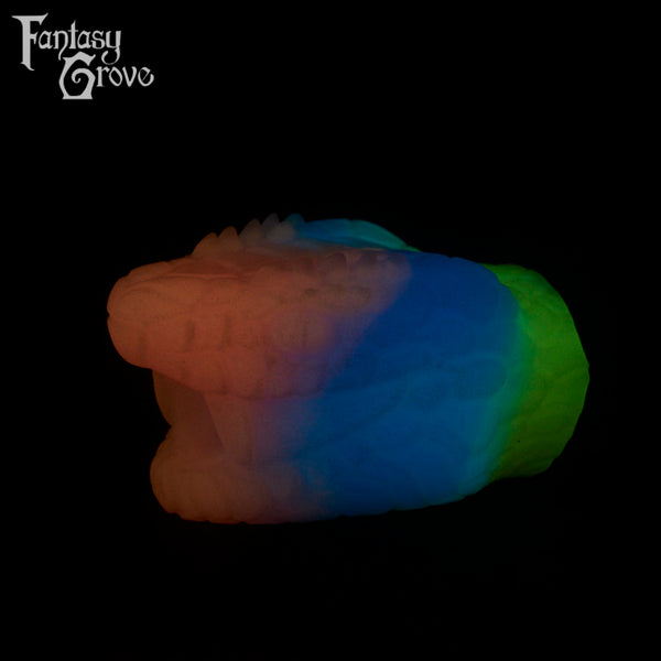 A Fantasy Grove sex toy on a black background with a logo in the upper left corner