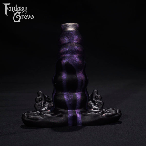 A Fantasy Grove sex toy on a black background with a logo in the upper left corner