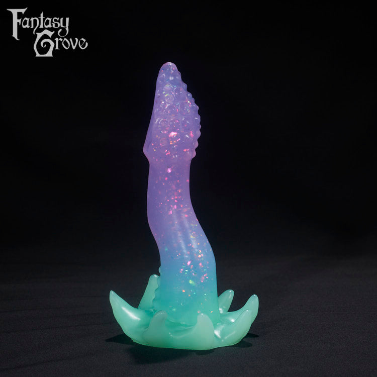A Fantasy Grove sex toy on a black background with a logo in the upper left corner