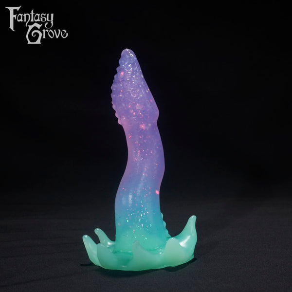 A Fantasy Grove sex toy on a black background with a logo in the upper left corner