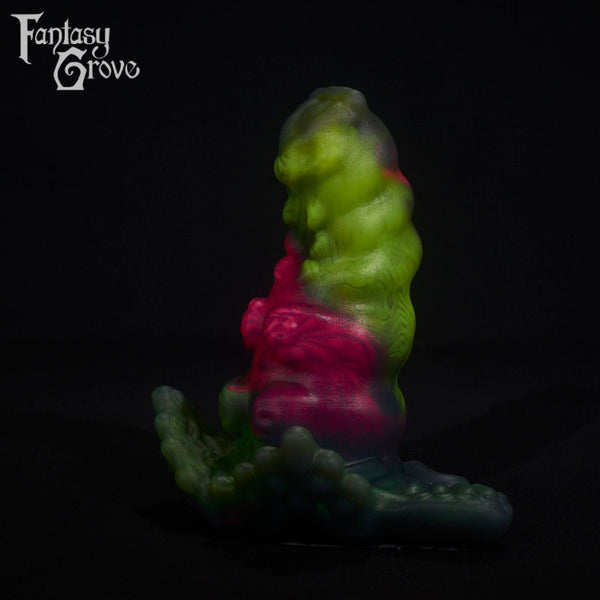 A fantasy sex toy on a black background with the Fantasy Grove logo in the upper left corner
