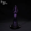 A Fantasy Grove sex toy on a black background with a logo in the upper left corner