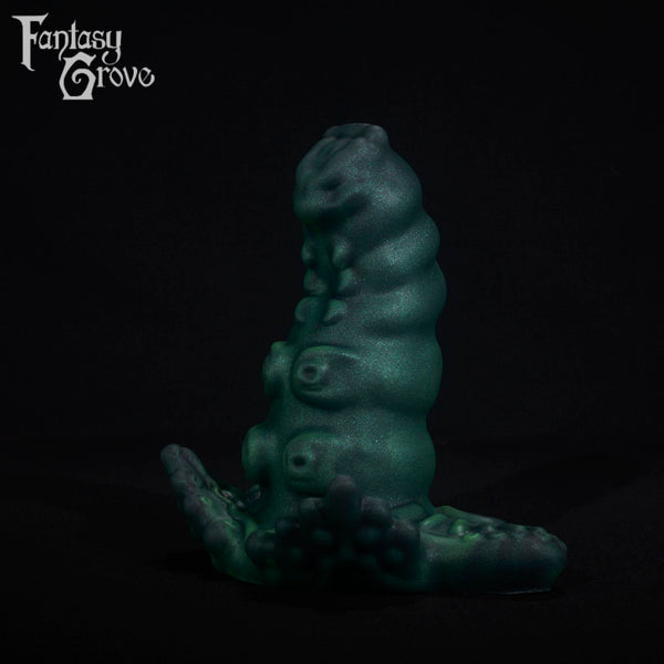 A fantasy sex toy on a black background with the Fantasy Grove logo in the upper left corner