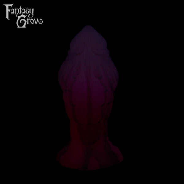 A Fantasy Grove sex toy on a black background with a logo in the upper left corner