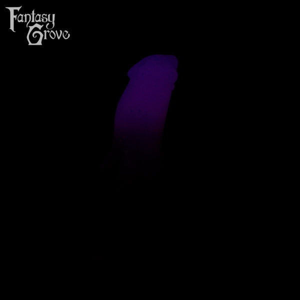 A fantasy sex toy on a black background with the Fantasy Grove logo in the upper left corner