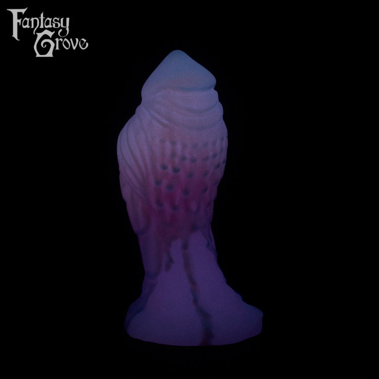 A Fantasy Grove sex toy on a black background with a logo in the upper left corner