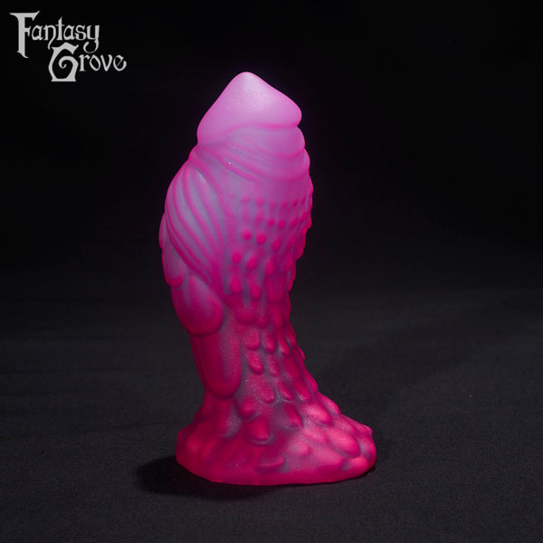 A Fantasy Grove sex toy on a black background with a logo in the upper left corner