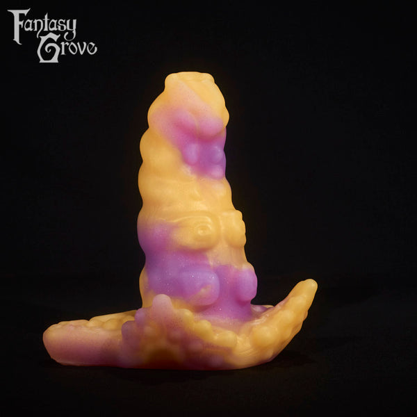 A fantasy sex toy on a black background with the Fantasy Grove logo in the upper left corner