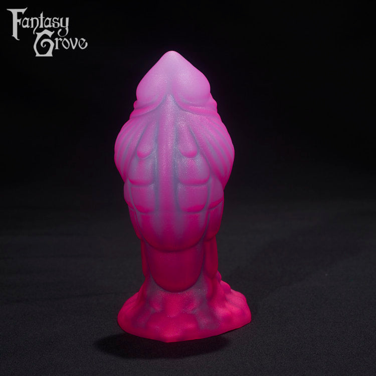 A Fantasy Grove sex toy on a black background with a logo in the upper left corner