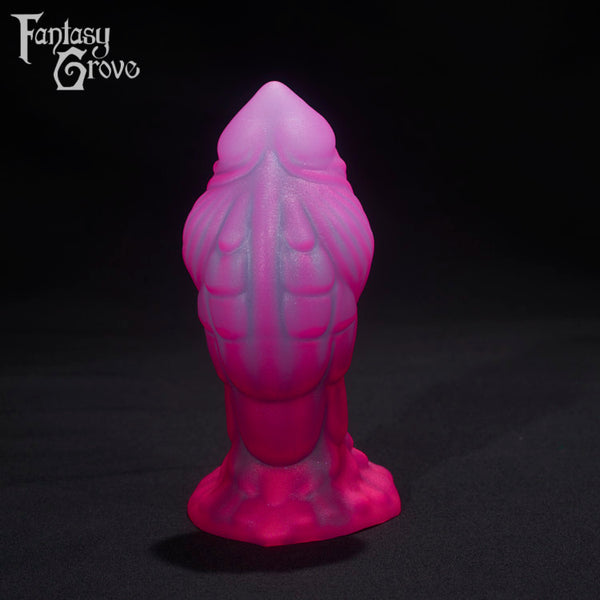A Fantasy Grove sex toy on a black background with a logo in the upper left corner