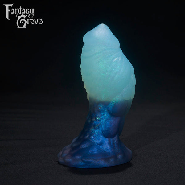 A Fantasy Grove sex toy on a black background with a logo in the upper left corner