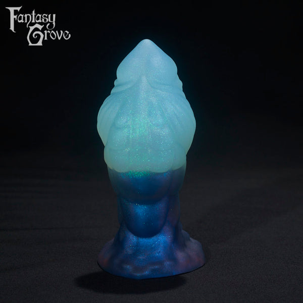 A Fantasy Grove sex toy on a black background with a logo in the upper left corner