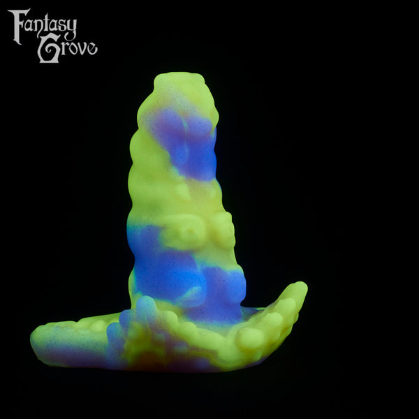 A fantasy sex toy on a black background with the Fantasy Grove logo in the upper left corner
