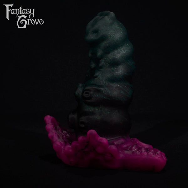 A fantasy sex toy on a black background with the Fantasy Grove logo in the upper left corner