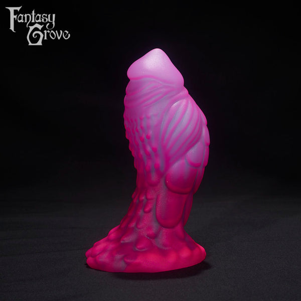 A Fantasy Grove sex toy on a black background with a logo in the upper left corner