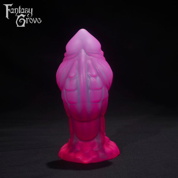 A Fantasy Grove sex toy on a black background with a logo in the upper left corner