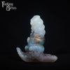 A fantasy sex toy on a black background with the Fantasy Grove logo in the upper left corner