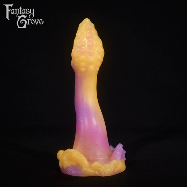A fantasy sex toy on a black background with the Fantasy Grove logo in the upper left corner