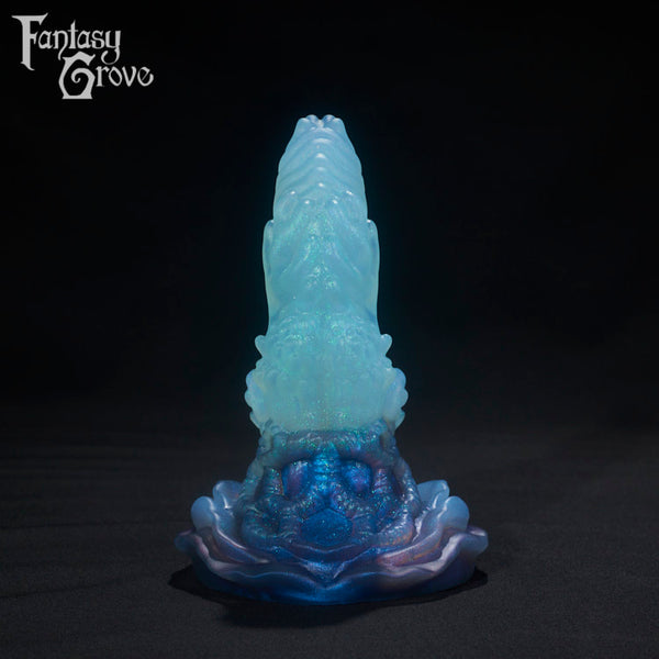 A Fantasy Grove sex toy on a black background with a logo in the upper left corner