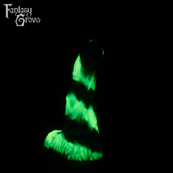 A fantasy sex toy on a black background with the Fantasy Grove logo in the upper left corner