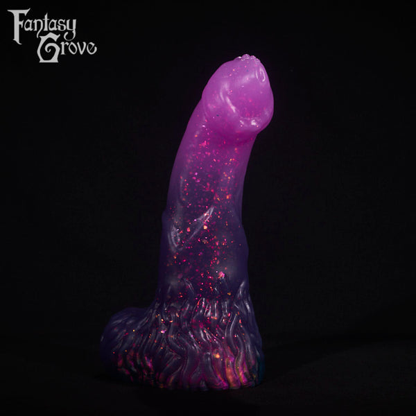 A fantasy sex toy on a black background with the Fantasy Grove logo in the upper left corner