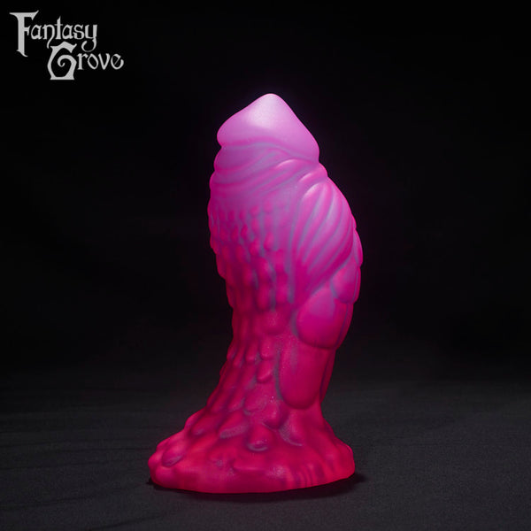 A Fantasy Grove sex toy on a black background with a logo in the upper left corner