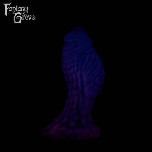 A Fantasy Grove sex toy on a black background with a logo in the upper left corner