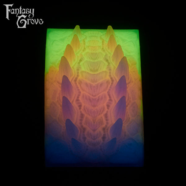 A Fantasy Grove sex toy on a black background with a logo in the upper left corner