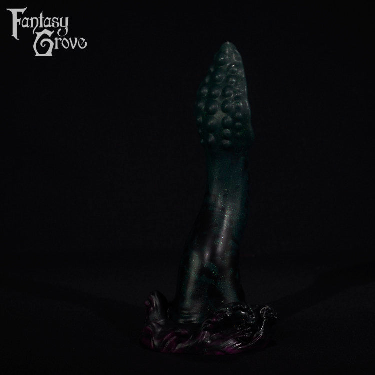 A fantasy sex toy on a black background with the Fantasy Grove logo in the upper left corner