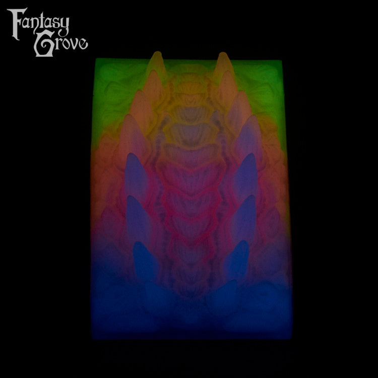 A Fantasy Grove sex toy on a black background with a logo in the upper left corner