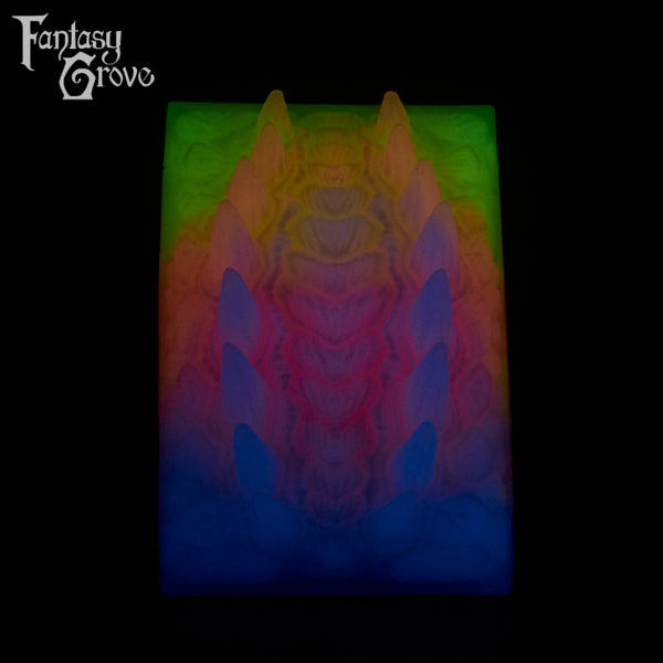 A Fantasy Grove sex toy on a black background with a logo in the upper left corner