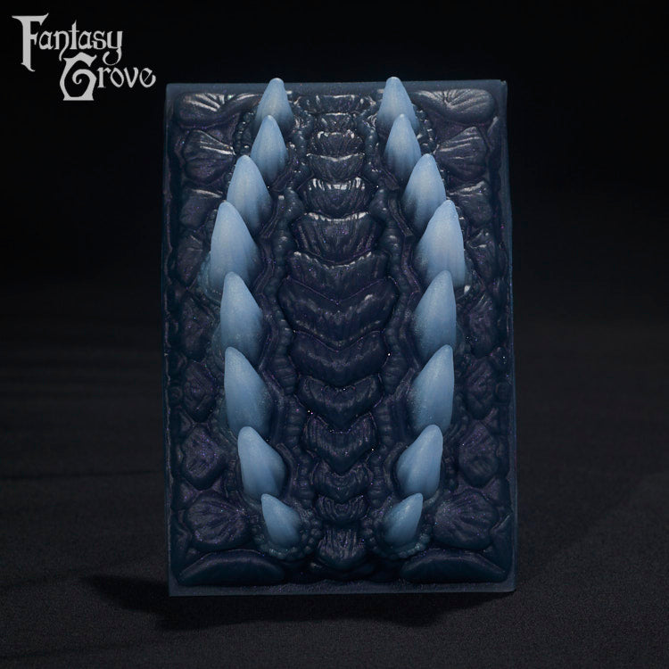 A Fantasy Grove sex toy on a black background with a logo in the upper left corner
