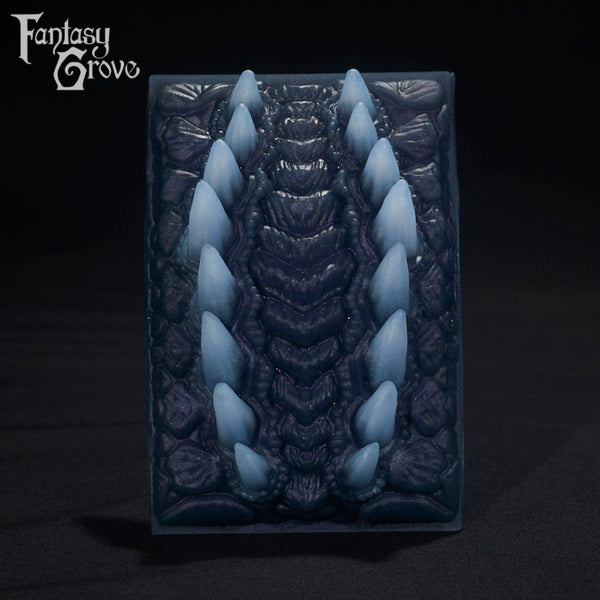 A Fantasy Grove sex toy on a black background with a logo in the upper left corner