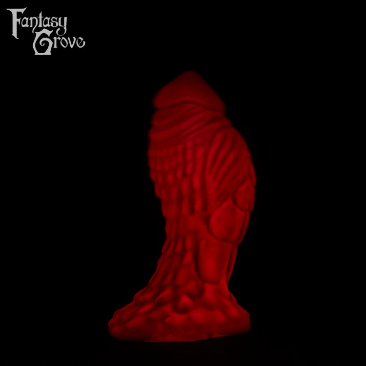 A Fantasy Grove sex toy on a black background with a logo in the upper left corner
