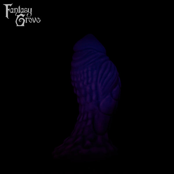 A Fantasy Grove sex toy on a black background with a logo in the upper left corner