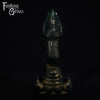 A fantasy sex toy on a black background with the Fantasy Grove logo in the upper left corner