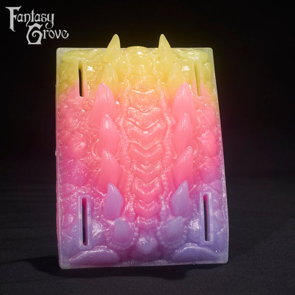 A Fantasy Grove sex toy on a black background with a logo in the upper left corner