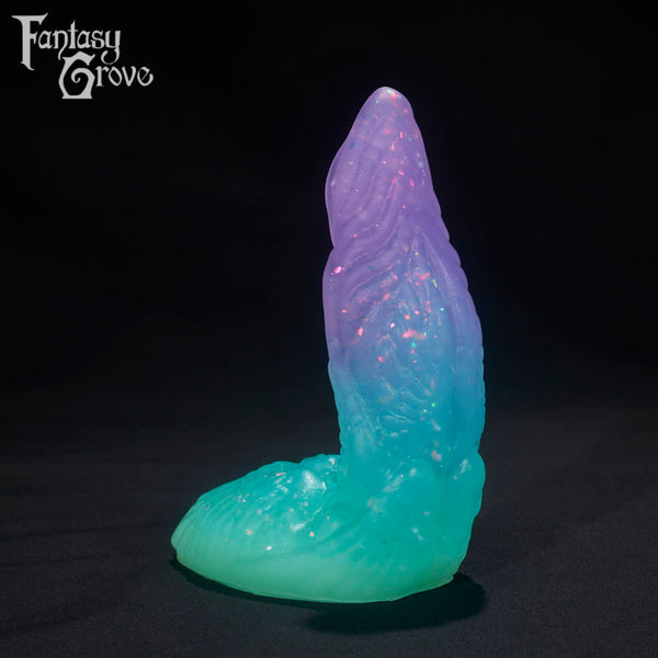 A Fantasy Grove sex toy on a black background with a logo in the upper left corner