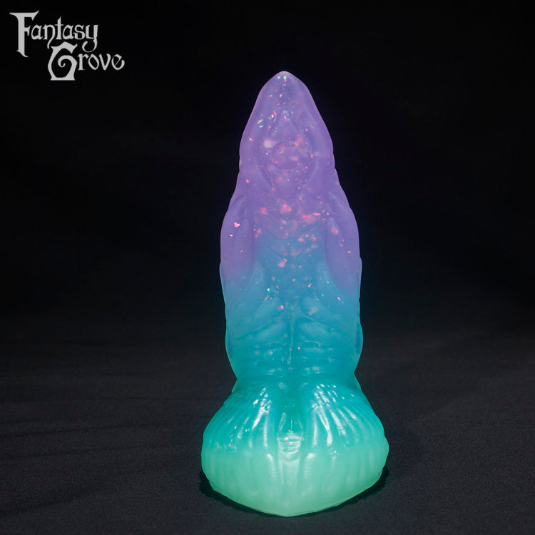 A Fantasy Grove sex toy on a black background with a logo in the upper left corner
