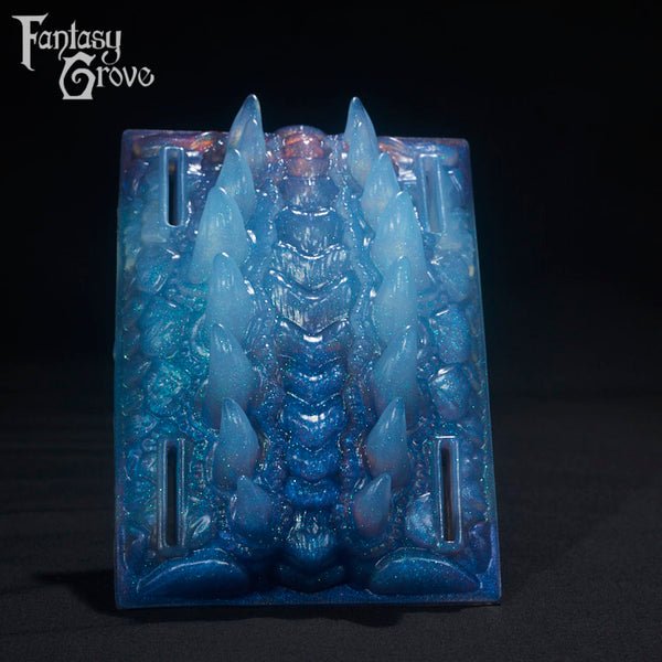 A Fantasy Grove sex toy on a black background with a logo in the upper left corner