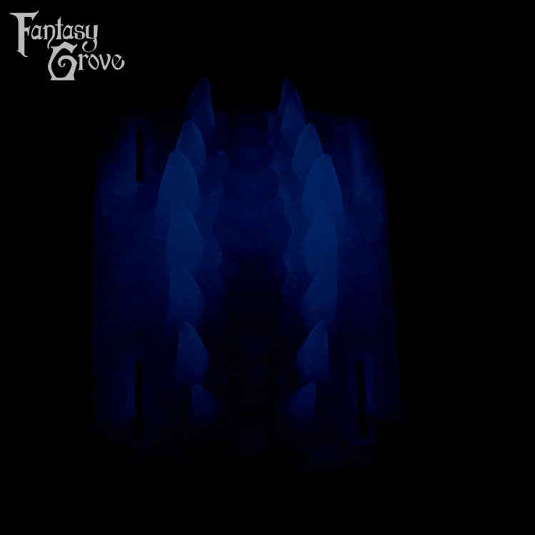 A Fantasy Grove sex toy on a black background with a logo in the upper left corner