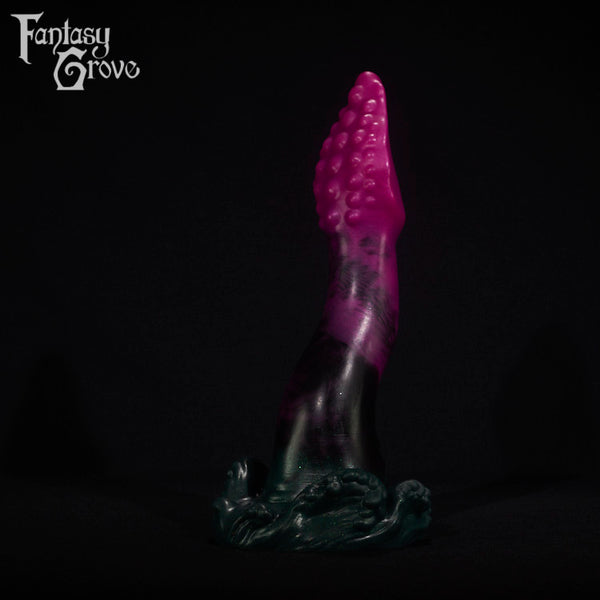 A fantasy sex toy on a black background with the Fantasy Grove logo in the upper left corner