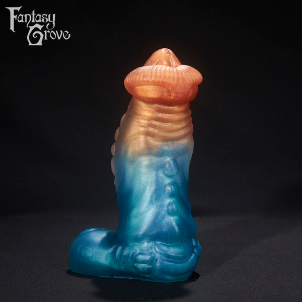 A fantasy sex toy on a black background with the Fantasy Grove logo in the upper left corner 