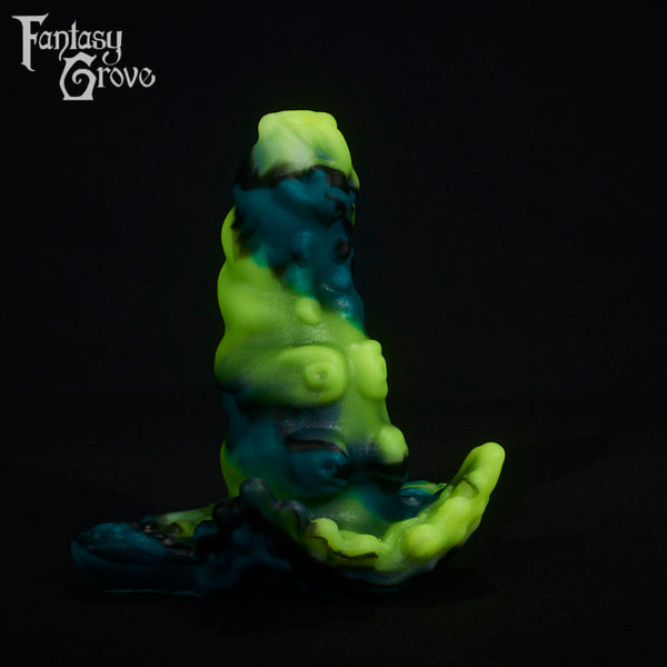 A fantasy sex toy on a black background with the Fantasy Grove logo in the upper left corner