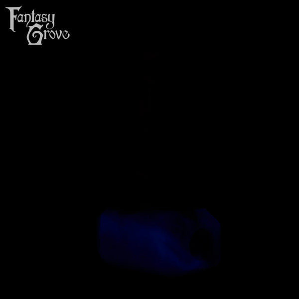 A Fantasy Grove sex toy on a black background with a logo in the upper left corner
