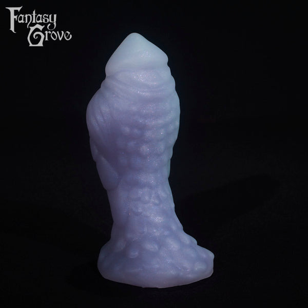 A fantasy sex toy on a black background with the Fantasy Grove logo in the upper left corner