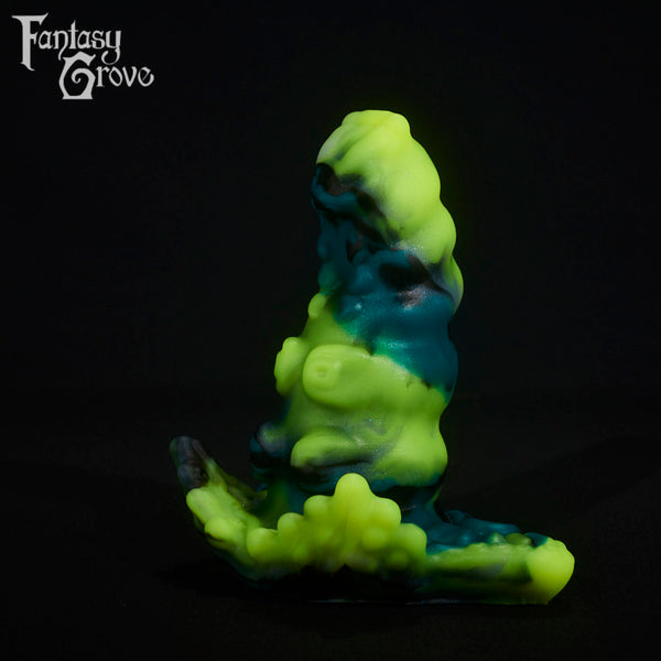 A fantasy sex toy on a black background with the Fantasy Grove logo in the upper left corner